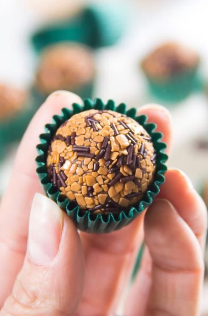 tinyb chocolate brigadeiro truffle in green wrapper