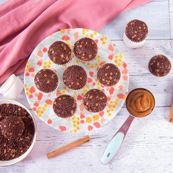 plate of chocolate truffles with dulce de leche spoon