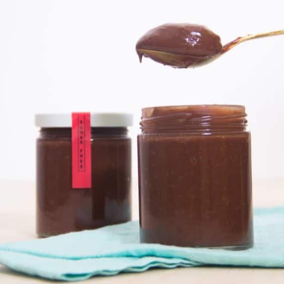 two jars of sugar free chocolate spread with spoon dipping