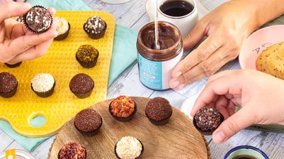 hands reaching for brigadieros